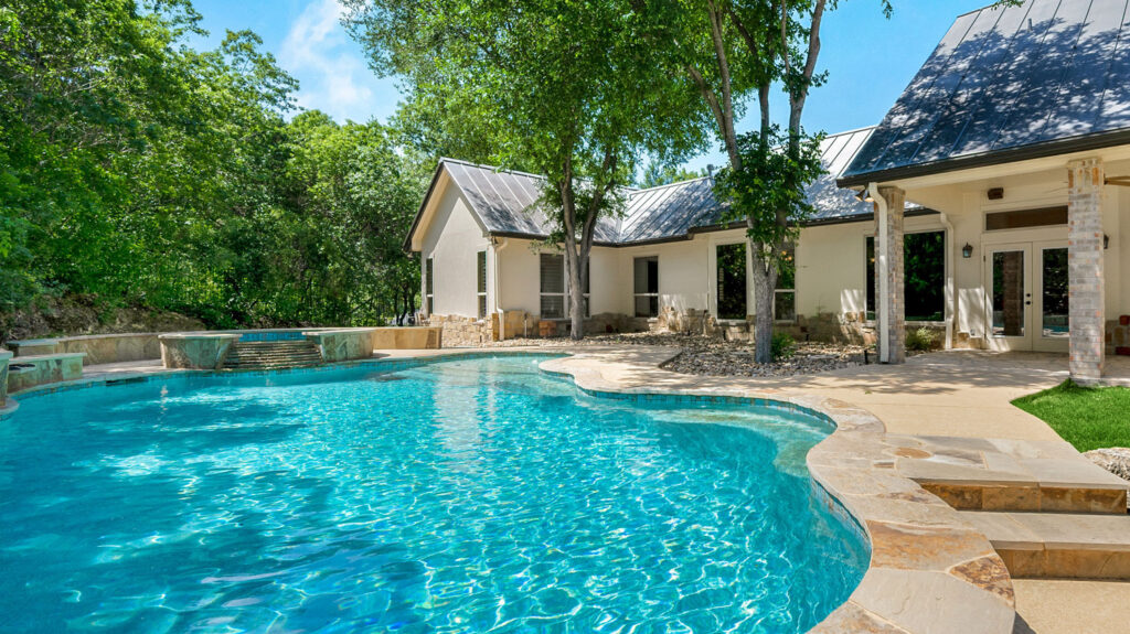 New Silver Leaf home in Stone Creek Estates with a backyard pool